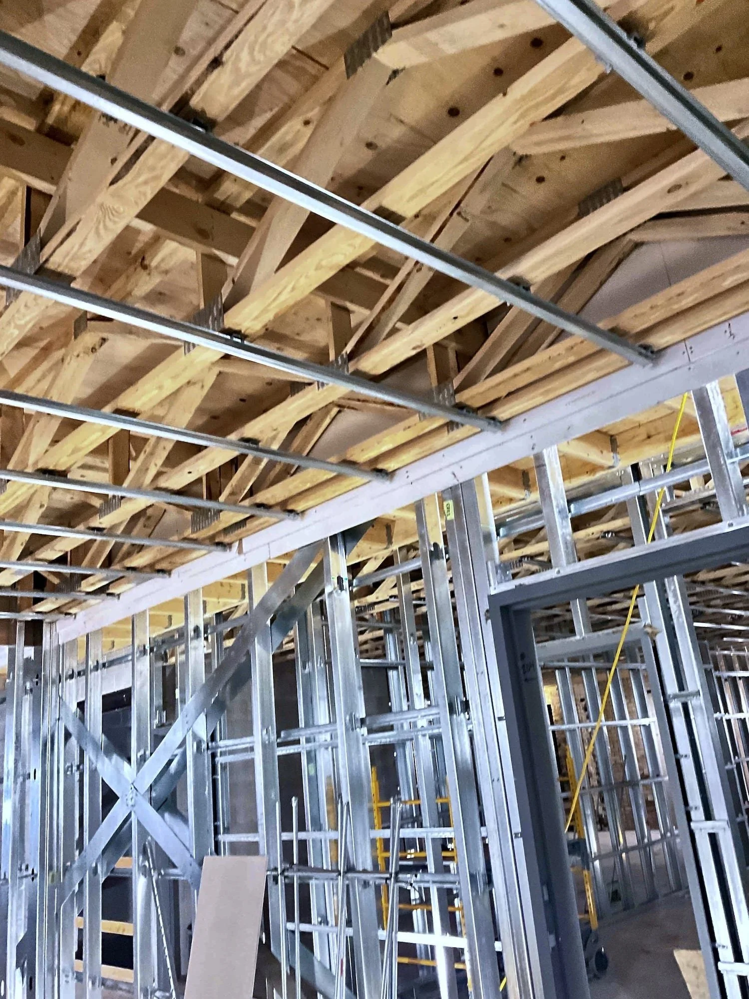 Complex metal stud framing with timber roof structure — Varsity Theater, Evanston